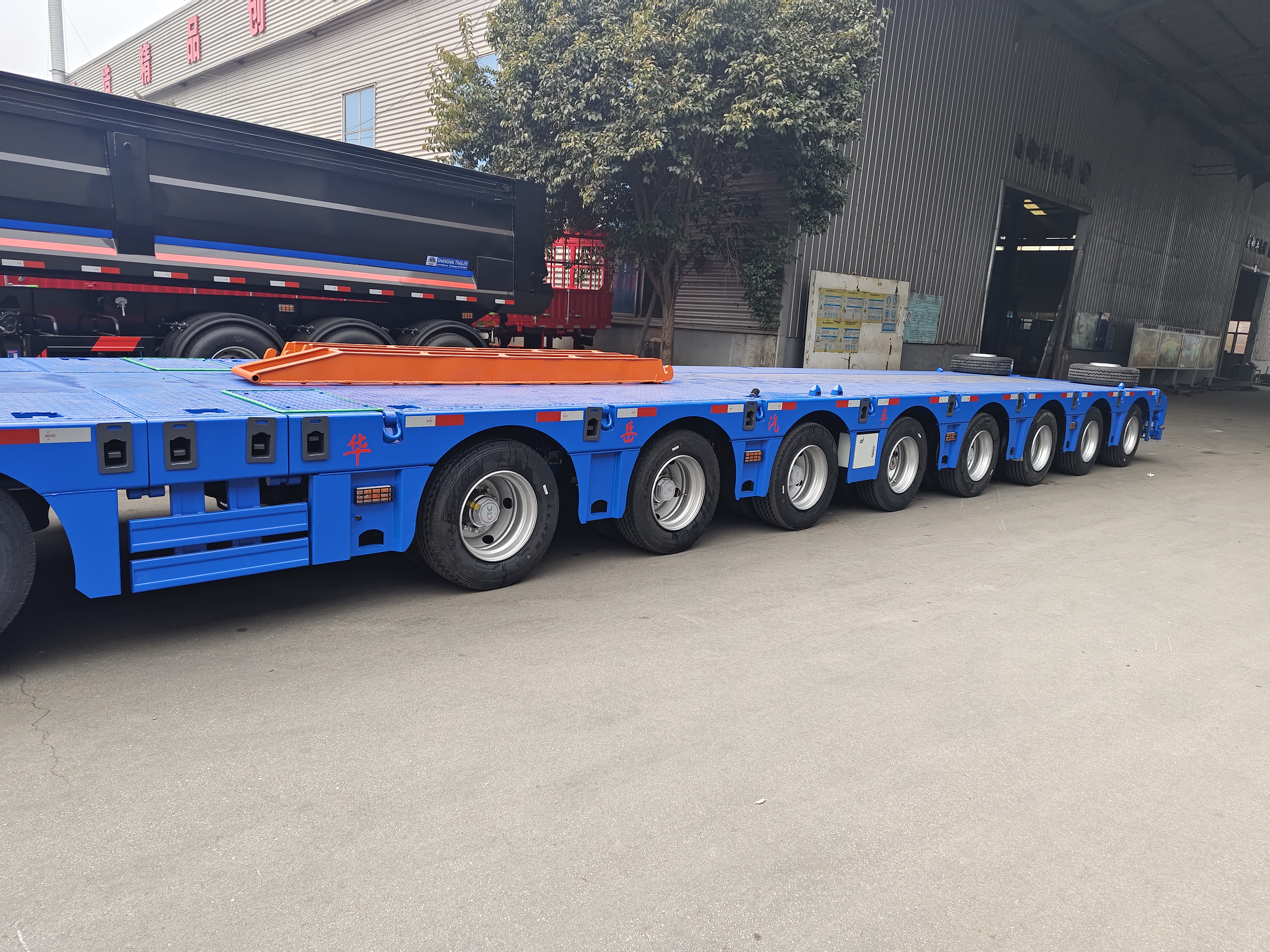 Rear view of the 10 axle extendable lowboy trailer showcasing its heavy-duty multi-axle suspension system