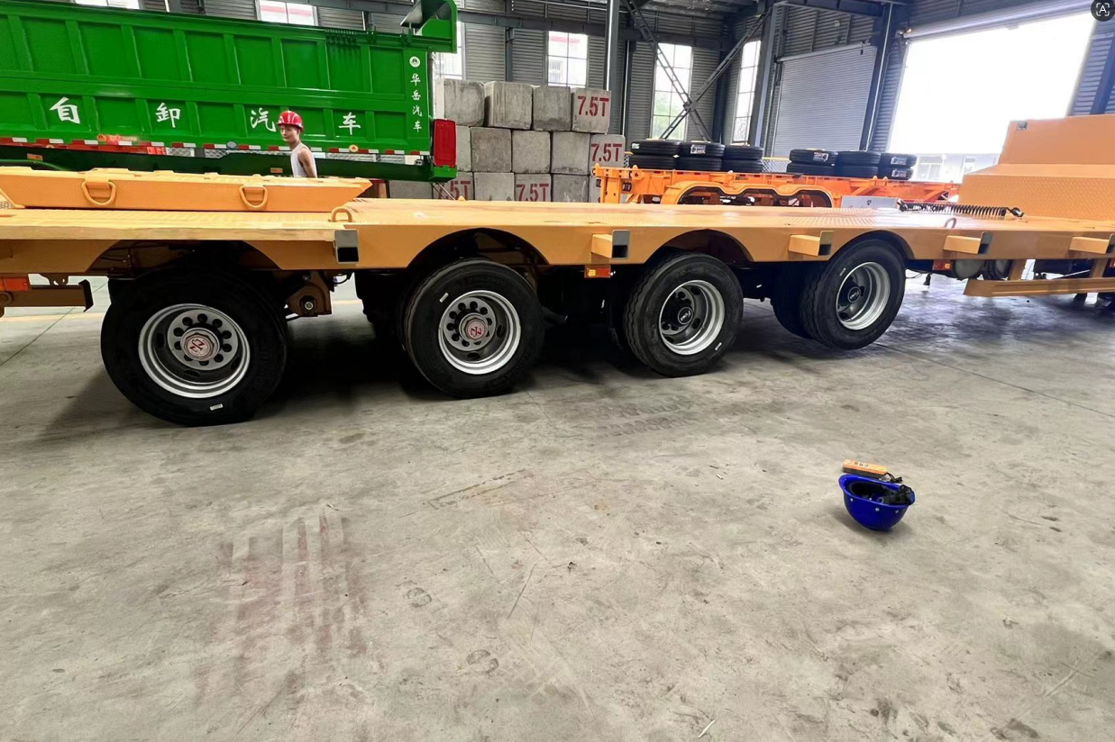 Close-up of a semi-trailer lift axle in an elevated position during an empty return trip, completely eliminating tire wear and friction.